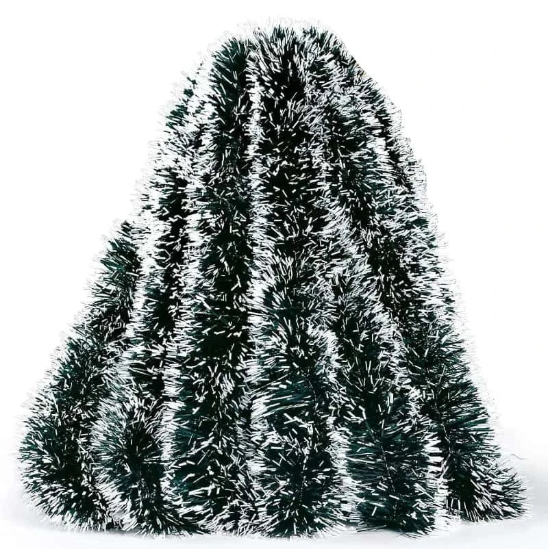 Decorative tinsel tree with a hand holding it on a white background