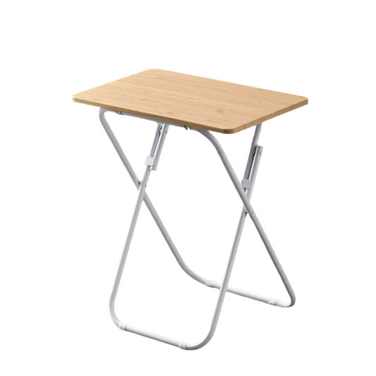 Foldable table with wooden top and white metal legs on a gray floor.
