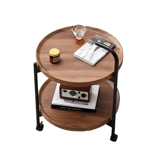 Wooden side table with books and a glass on a carpeted floor